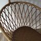 Vintage rattan cradle with its spire