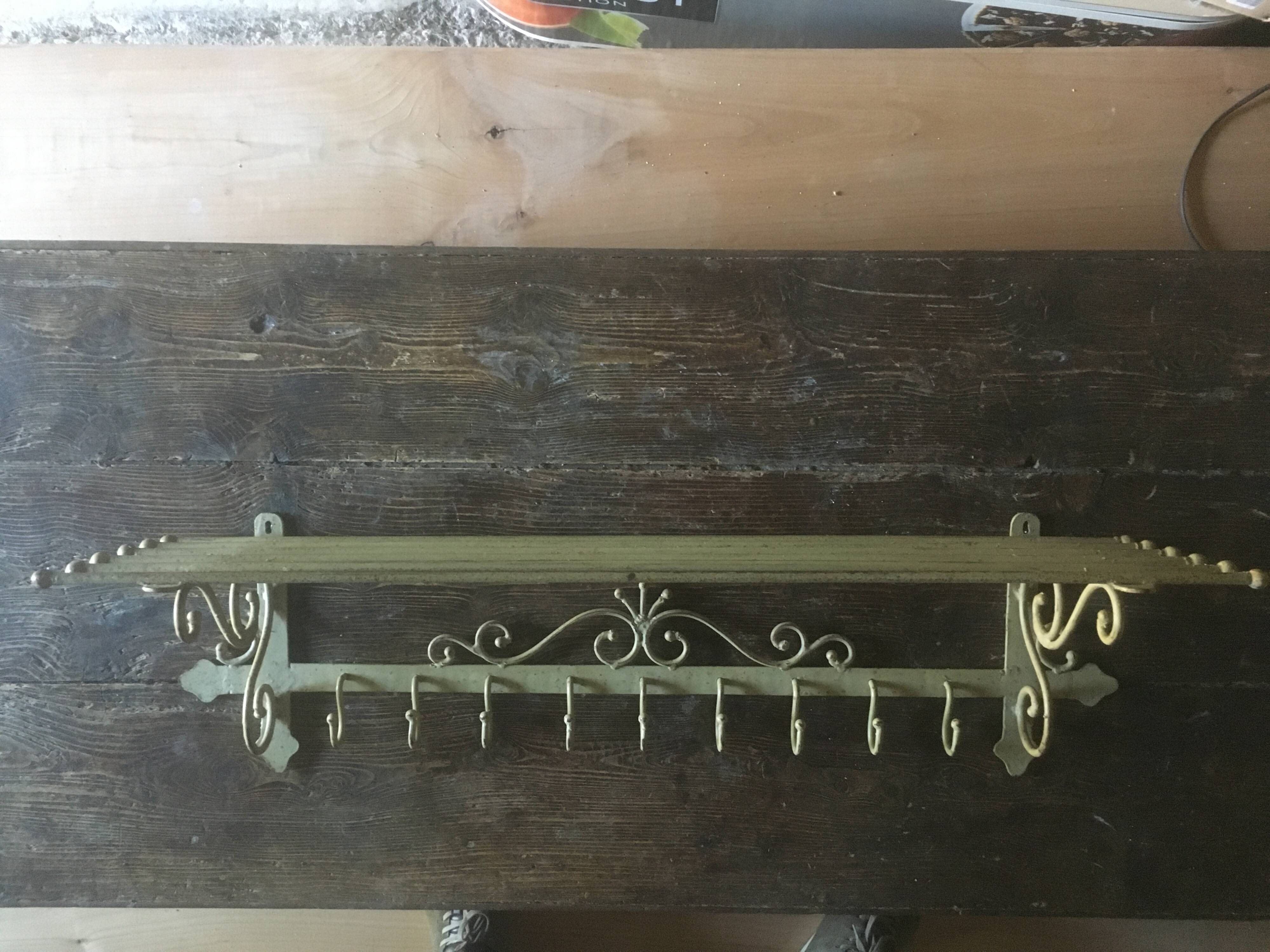 White wrought iron coat and hat rack