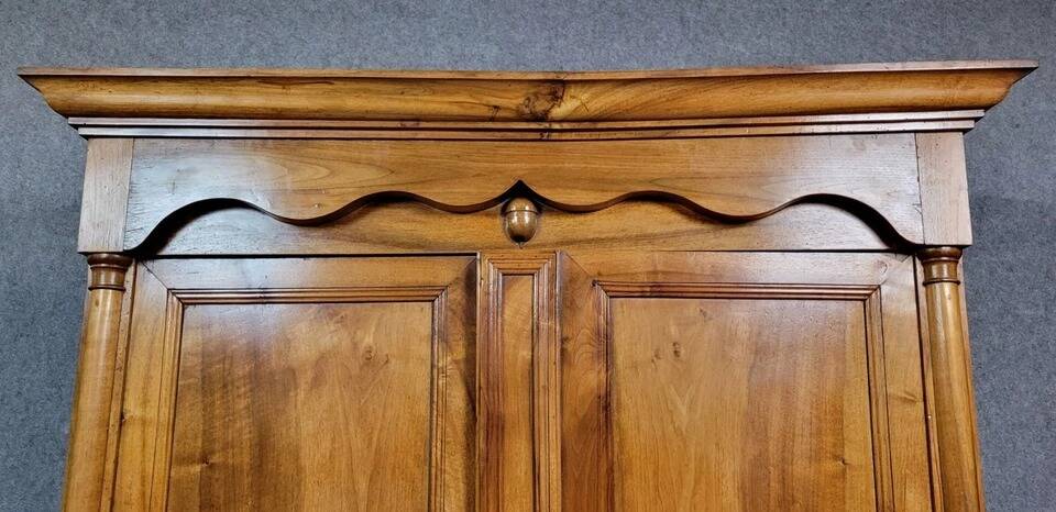 Exceptional Empire period wardrobe in solid walnut, 19th century, circa 1800
