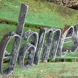 Former hairdresser sign "dames" in metal