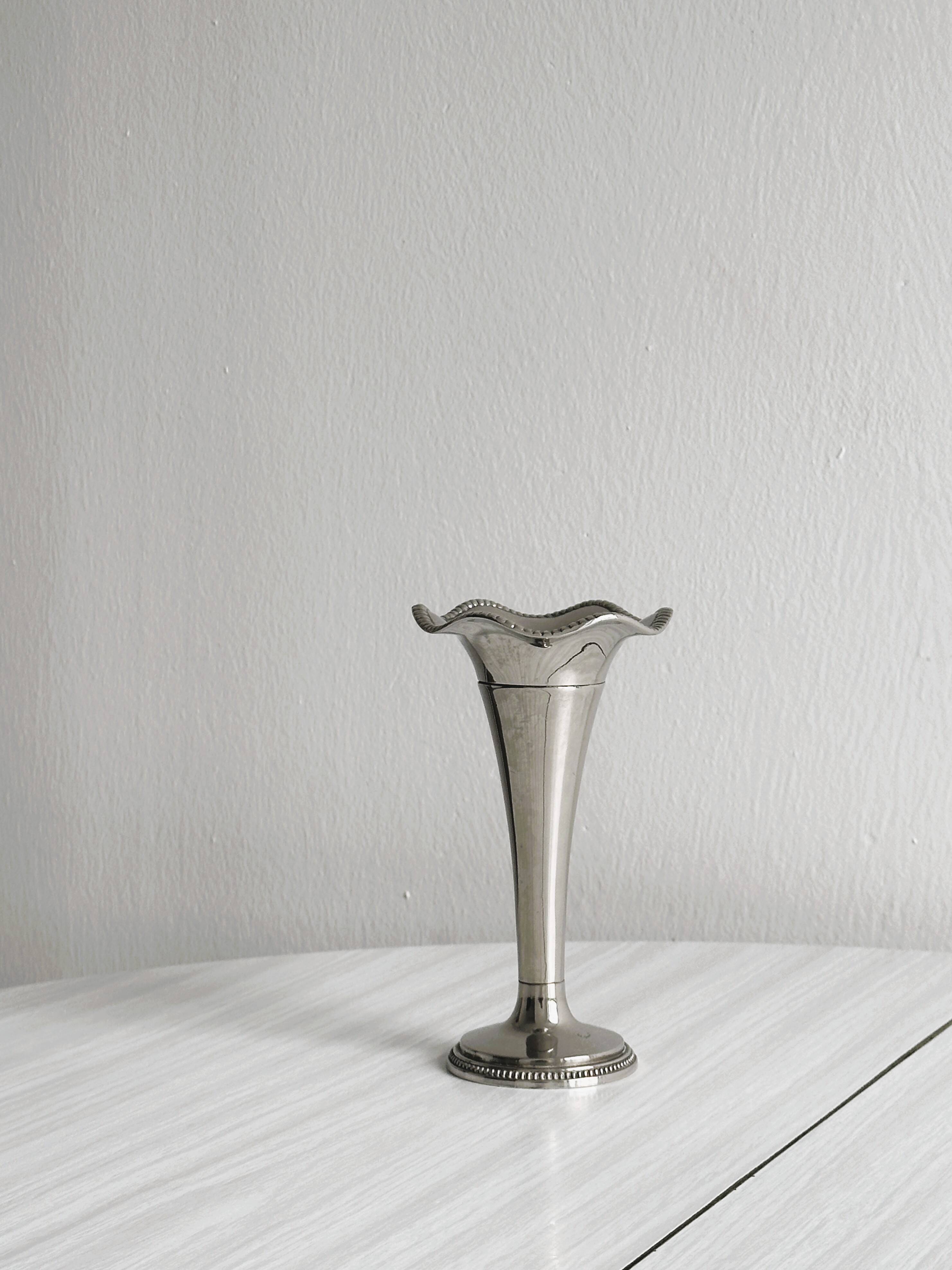 Small silver metal vase