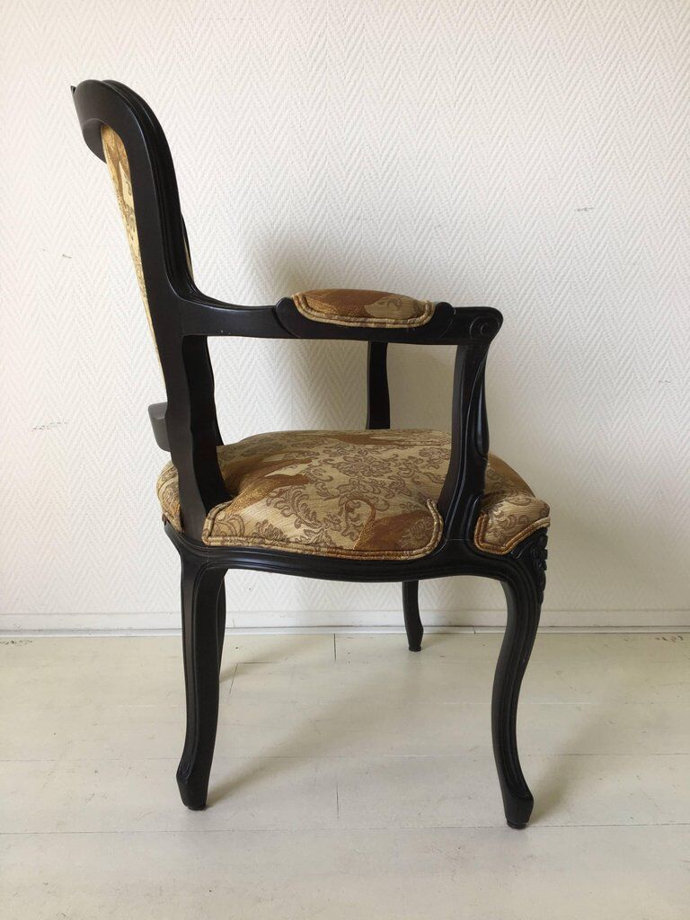 Black baroque armchair with fabric designed by wildlife by Ascension Latorre, Spain