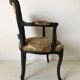 Black baroque armchair with fabric designed by wildlife by Ascension Latorre, Spain