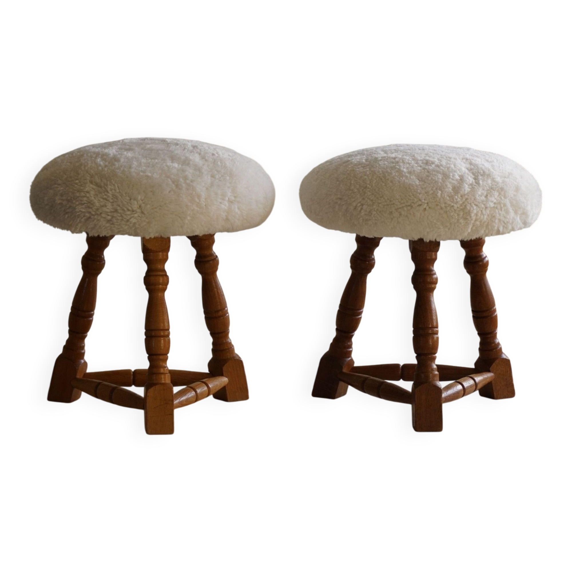 Modern Danish, a pair of tripod stools, seats reupholstered in lambswool, 1950s.