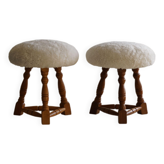 Modern Danish, a pair of tripod stools, seats reupholstered in lambswool, 1950s.