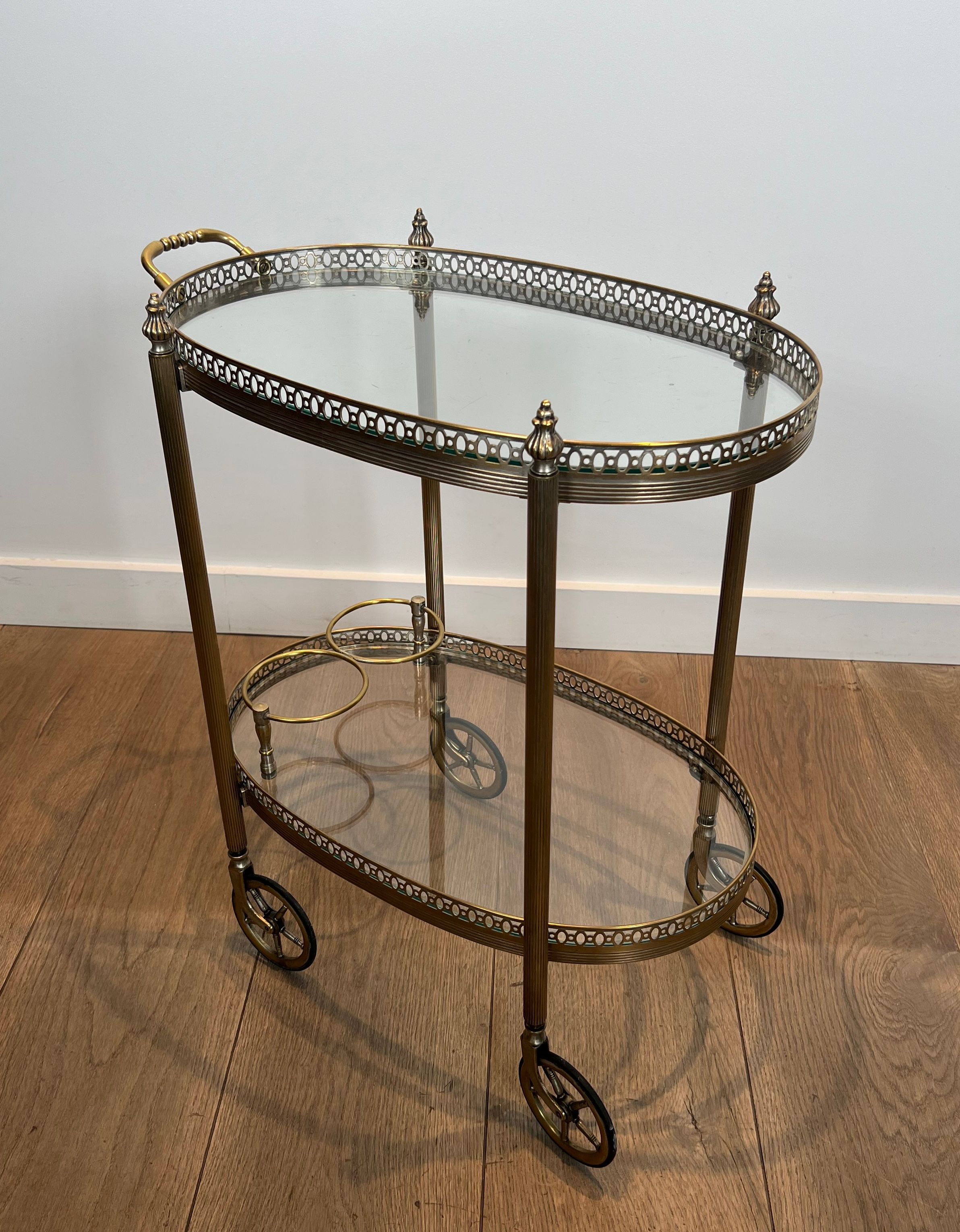 Small wheeled table in silvered brass from the Baguès house.