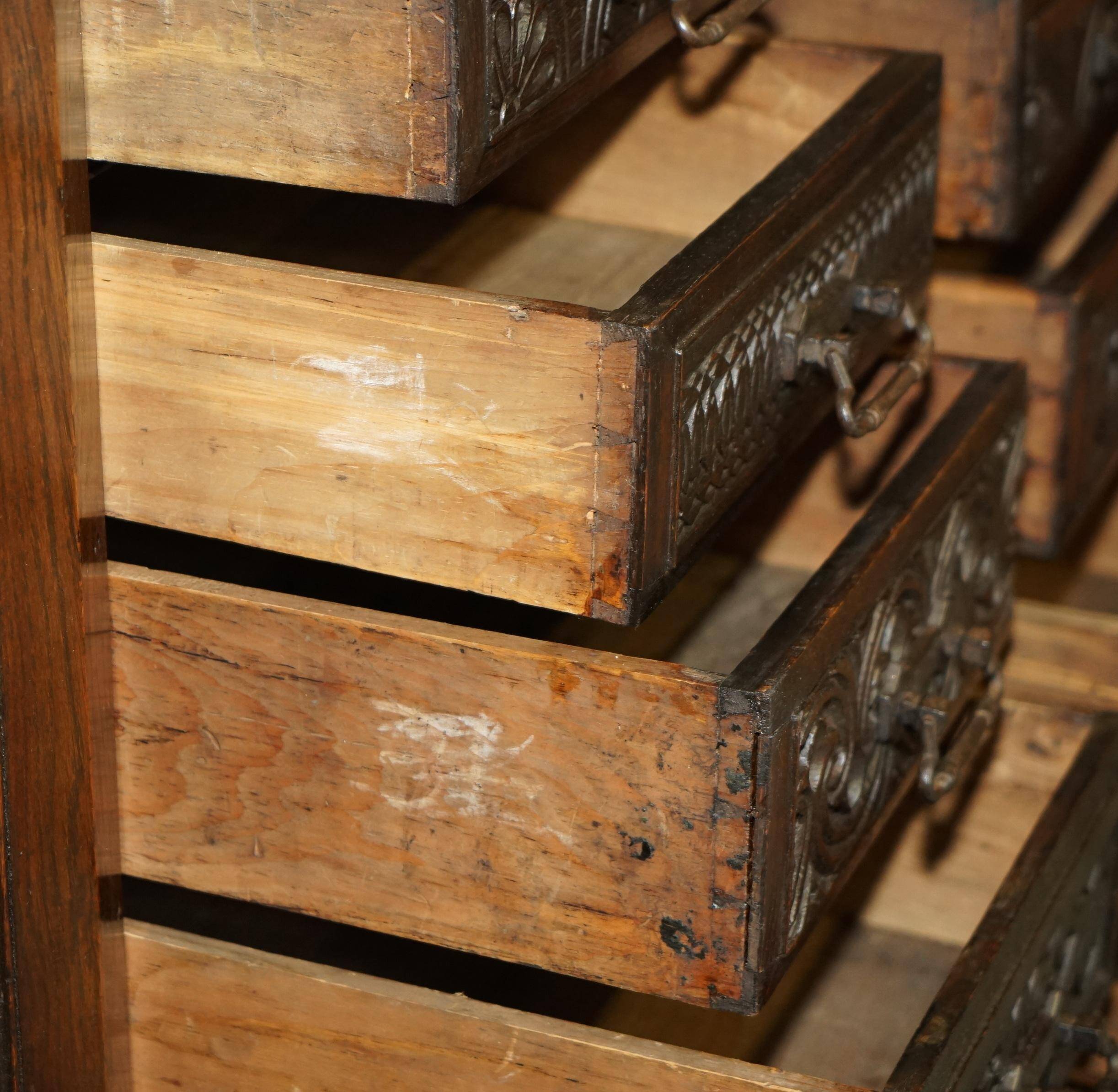 Hand-carved commode from 1685 with sideboards and side cupboards.
