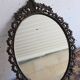 Miroir ovale en métal style baroque