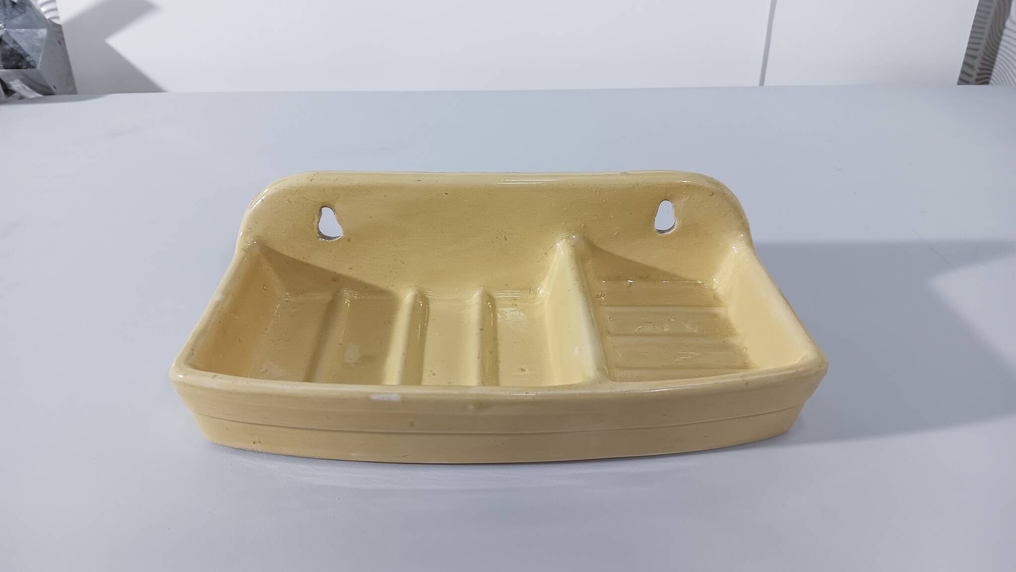 Pale yellow ceramic soap dish