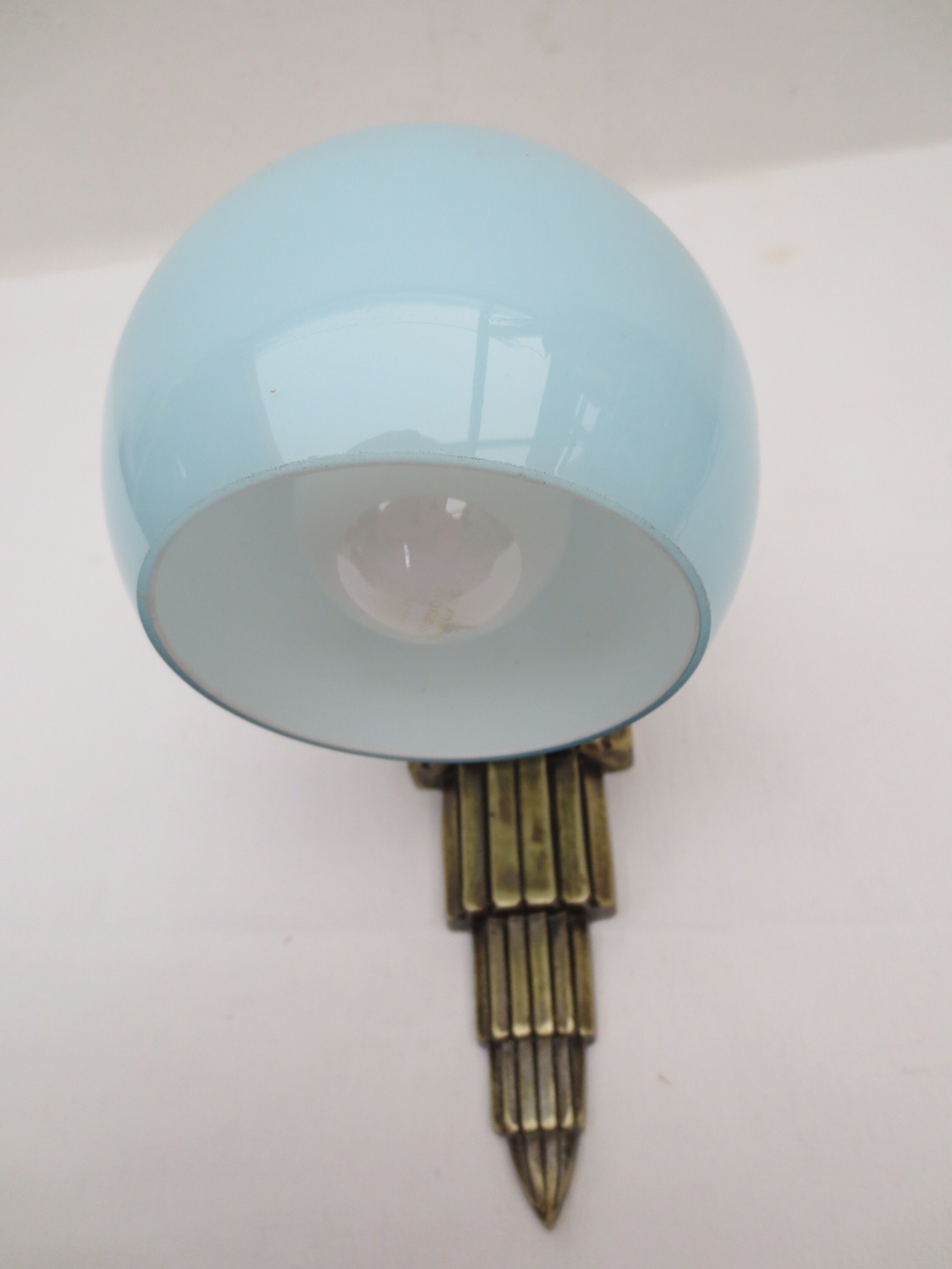 Art deco wall lamp in brass and soft blue opaline globe