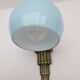 Applique art déco en laiton  et globe opaline bleu doux