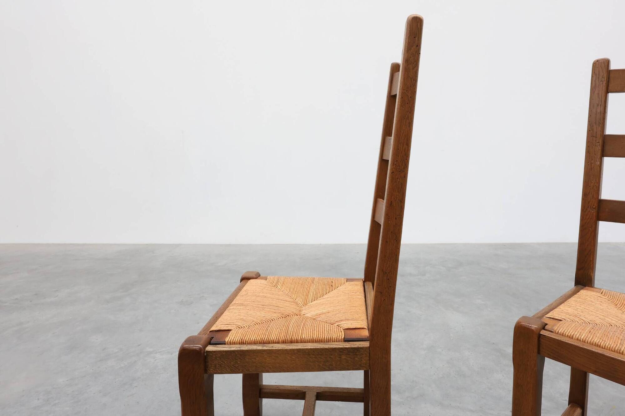 Set of 6 rustic oak ladder-back chairs with rush seats, France, 20th centur