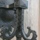 Pair of black wrought iron wall sconces - neo-Gothic style - from the 1950s