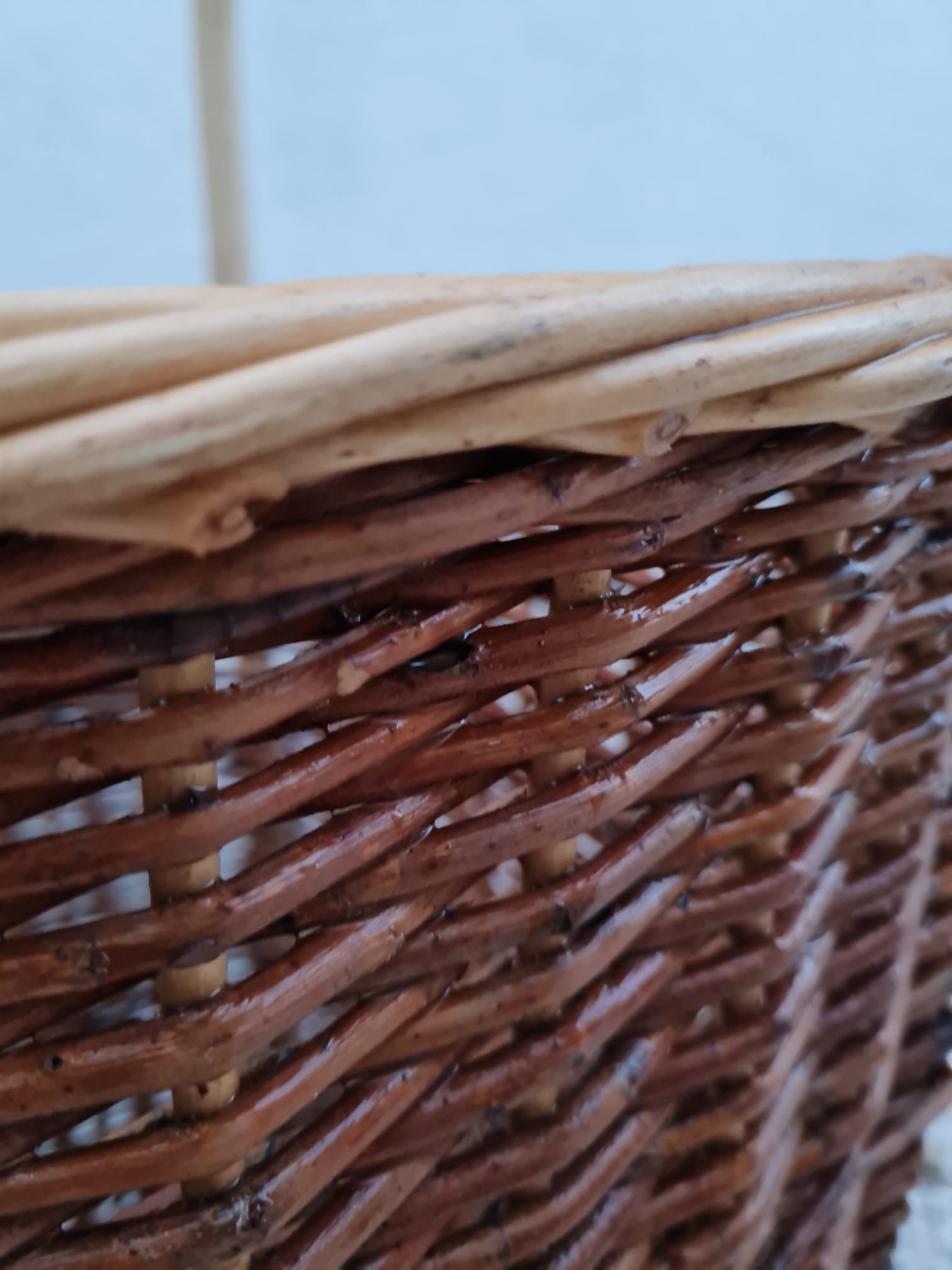 Vintage wicker log basket on vintage wheels