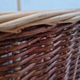 Vintage wicker log basket on vintage wheels