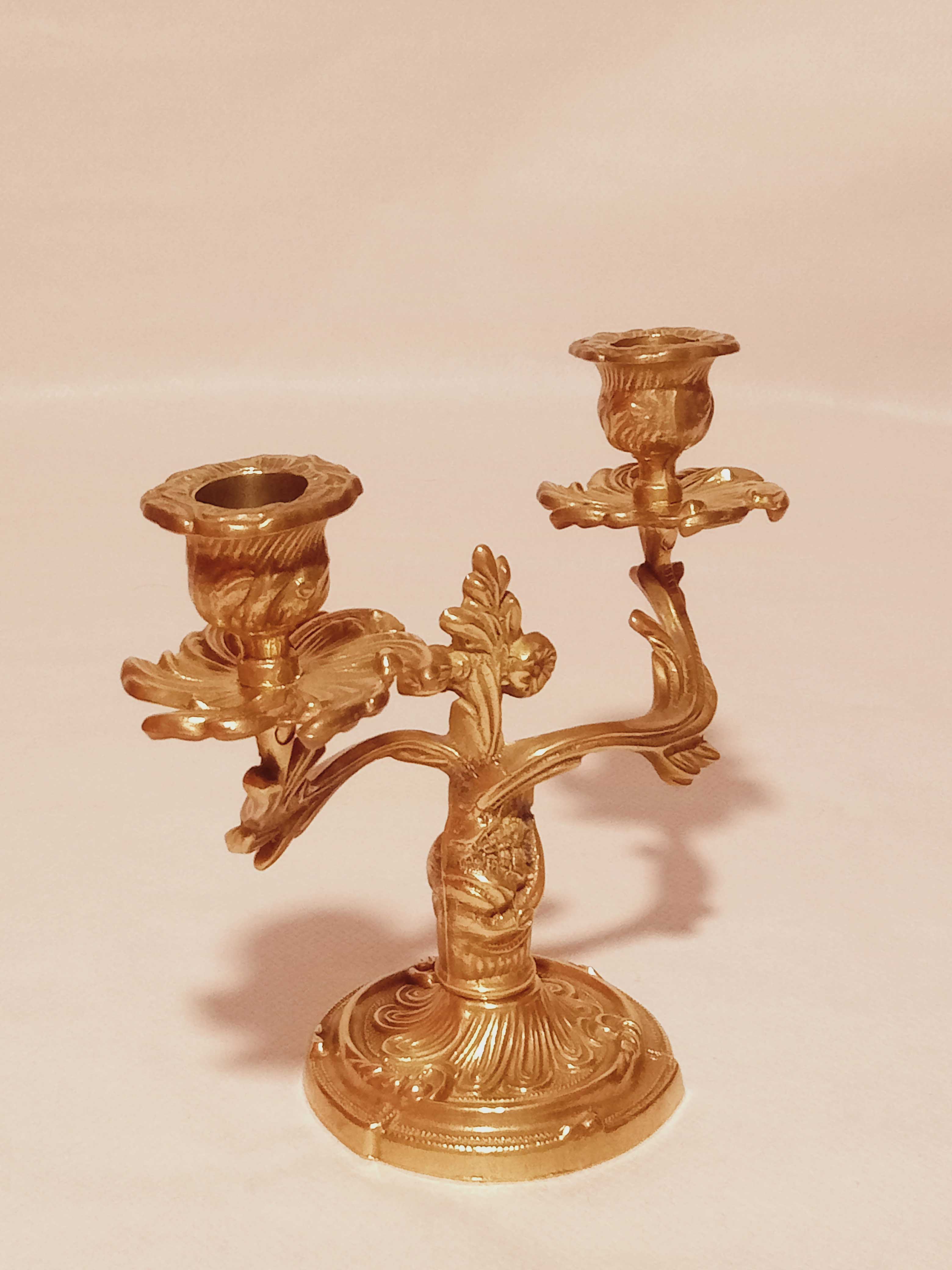 Old candle holder in gilded bronze