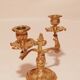 Old candle holder in gilded bronze