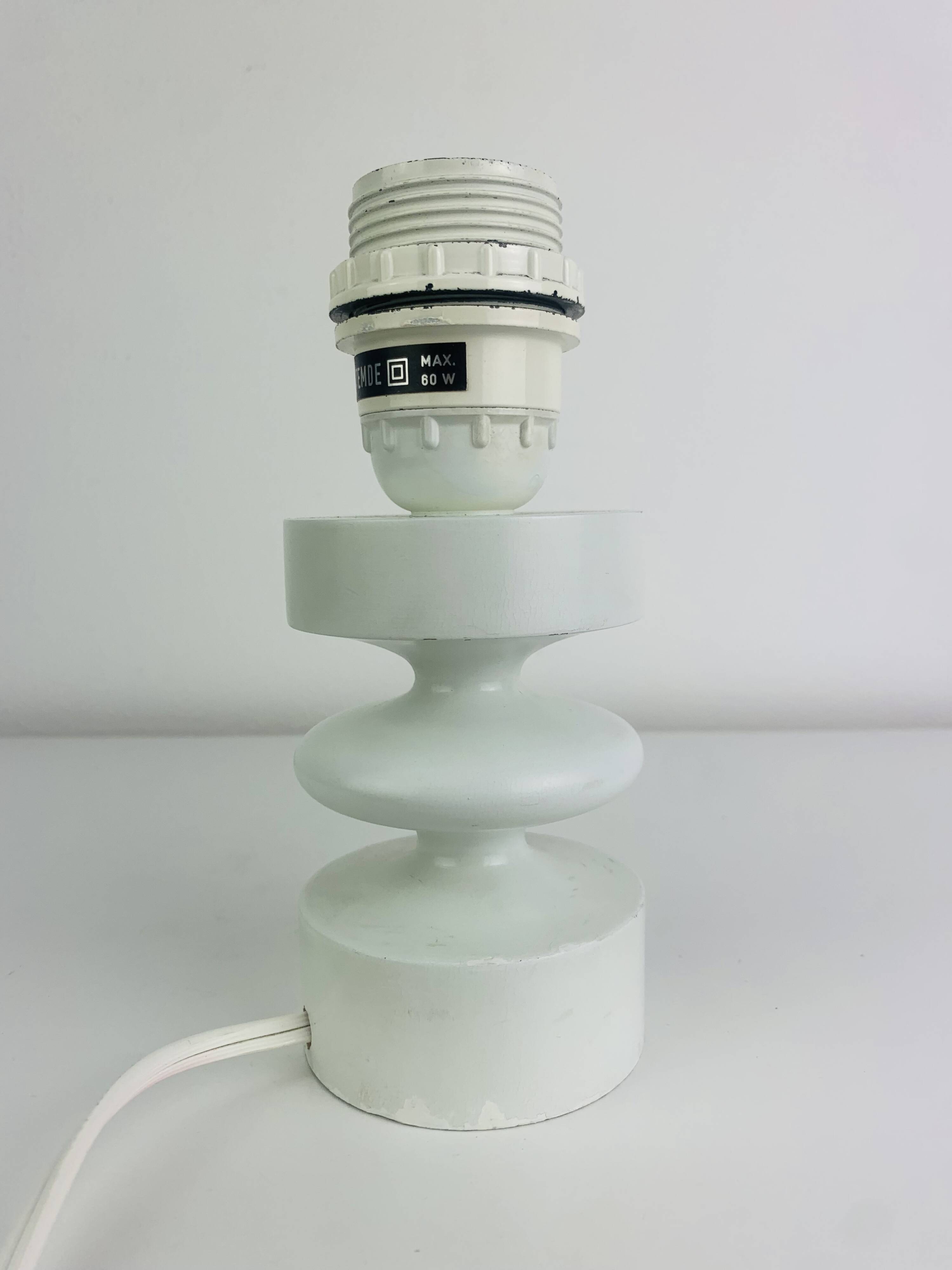 Temde lamp with turned wood and a seventies lampshade.