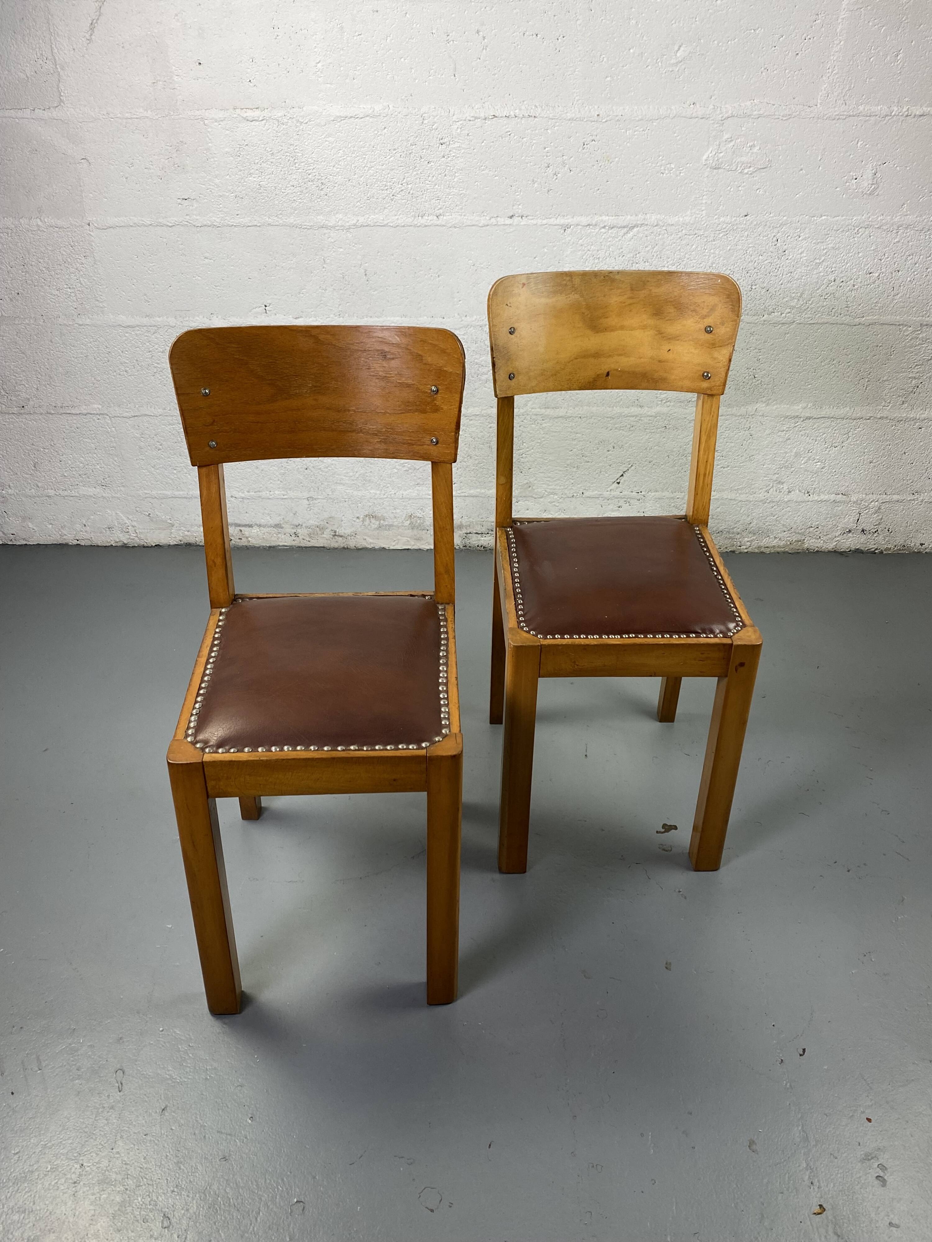 Pair of wooden and leather chairs