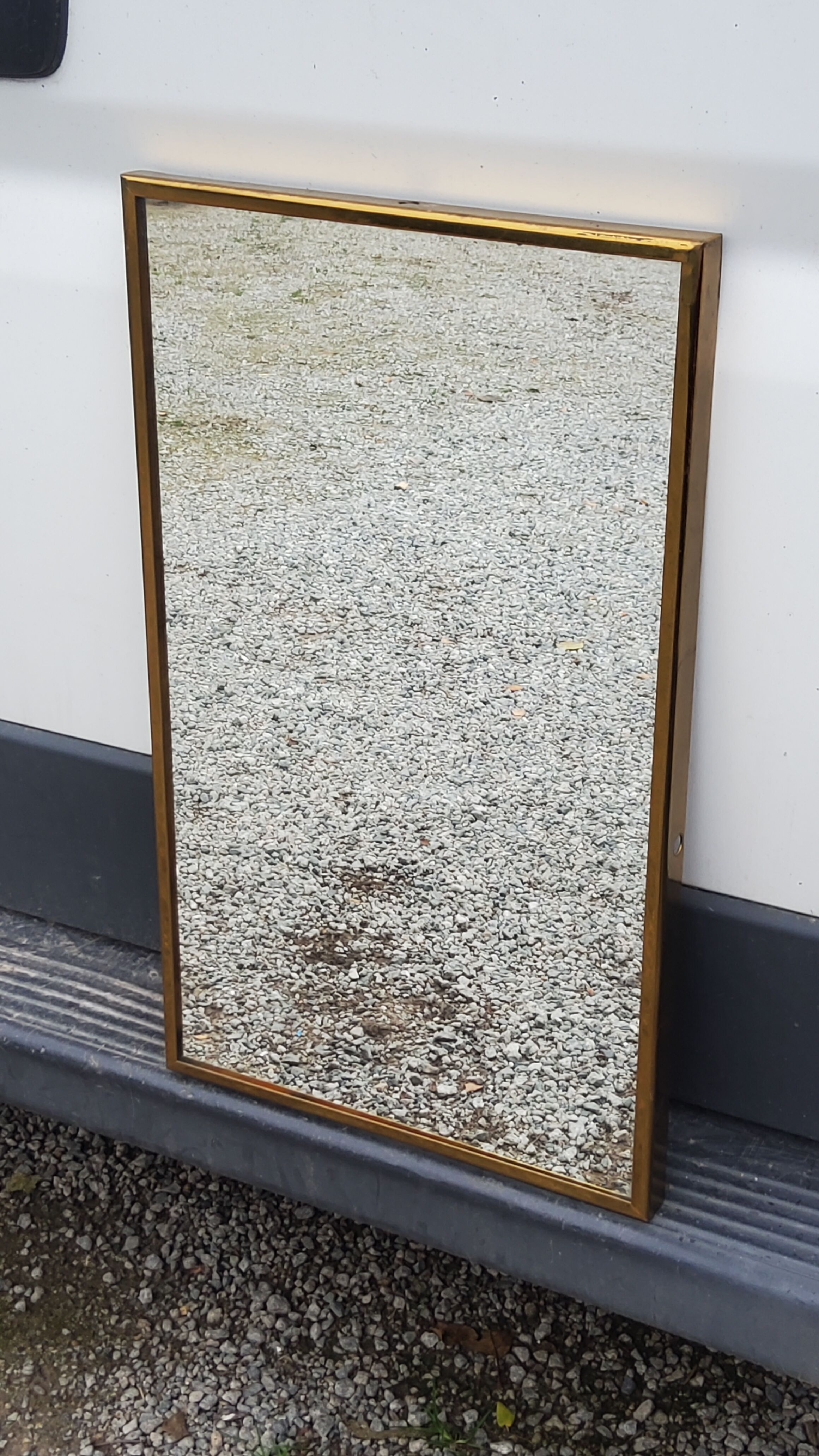Mirror of the 70s in gilded metal, 60x35 cm