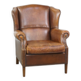 Cognac-colored sheepskin wing chair in English style