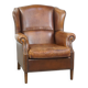 Cognac-colored sheepskin wing chair in English style