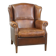 Cognac-colored sheepskin wing chair in English style