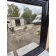 Black lacquered wood mirror "originally punctured"