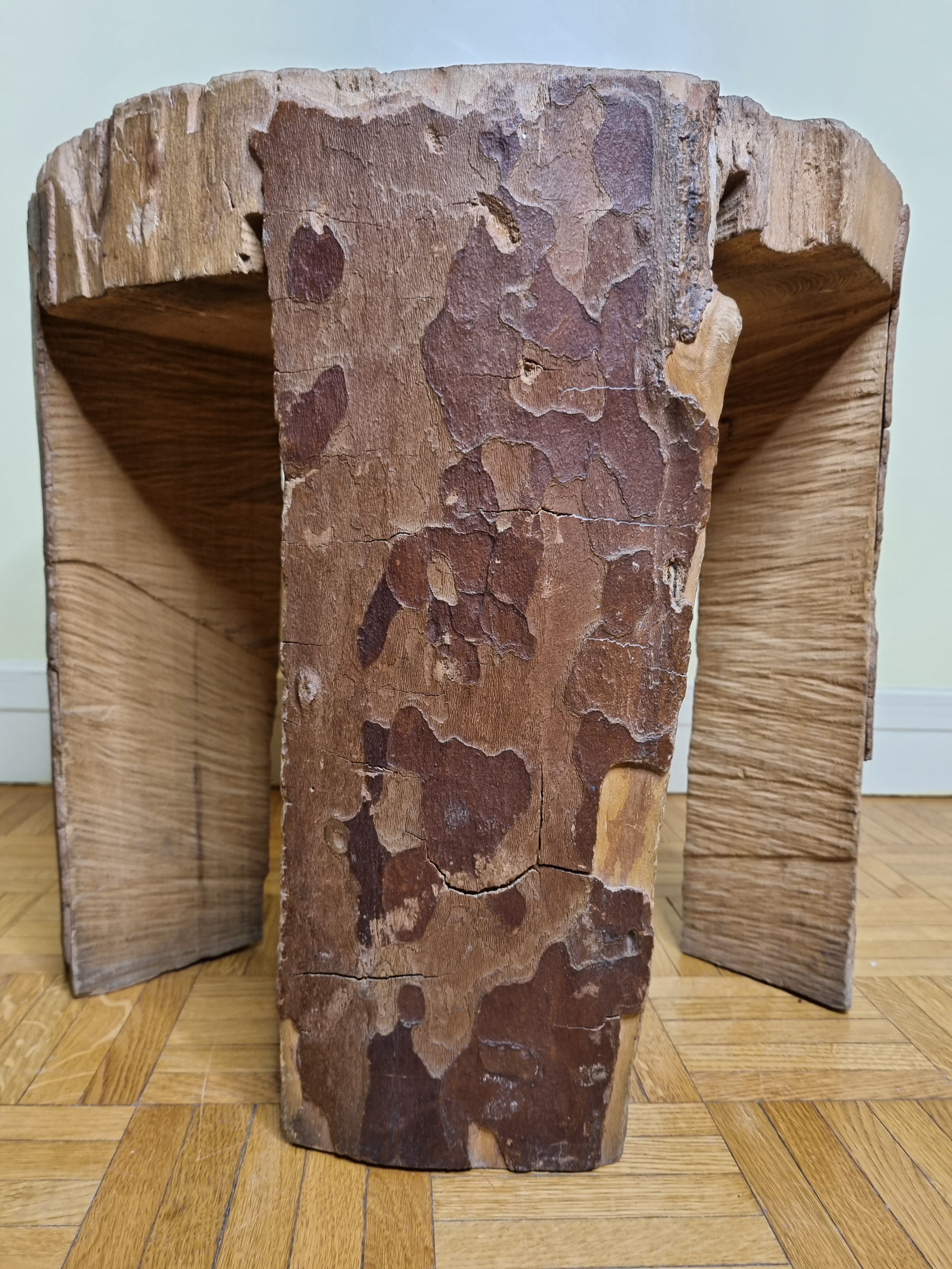 Brutalist solid wood coffee table carved from a room in a plane tree trunk