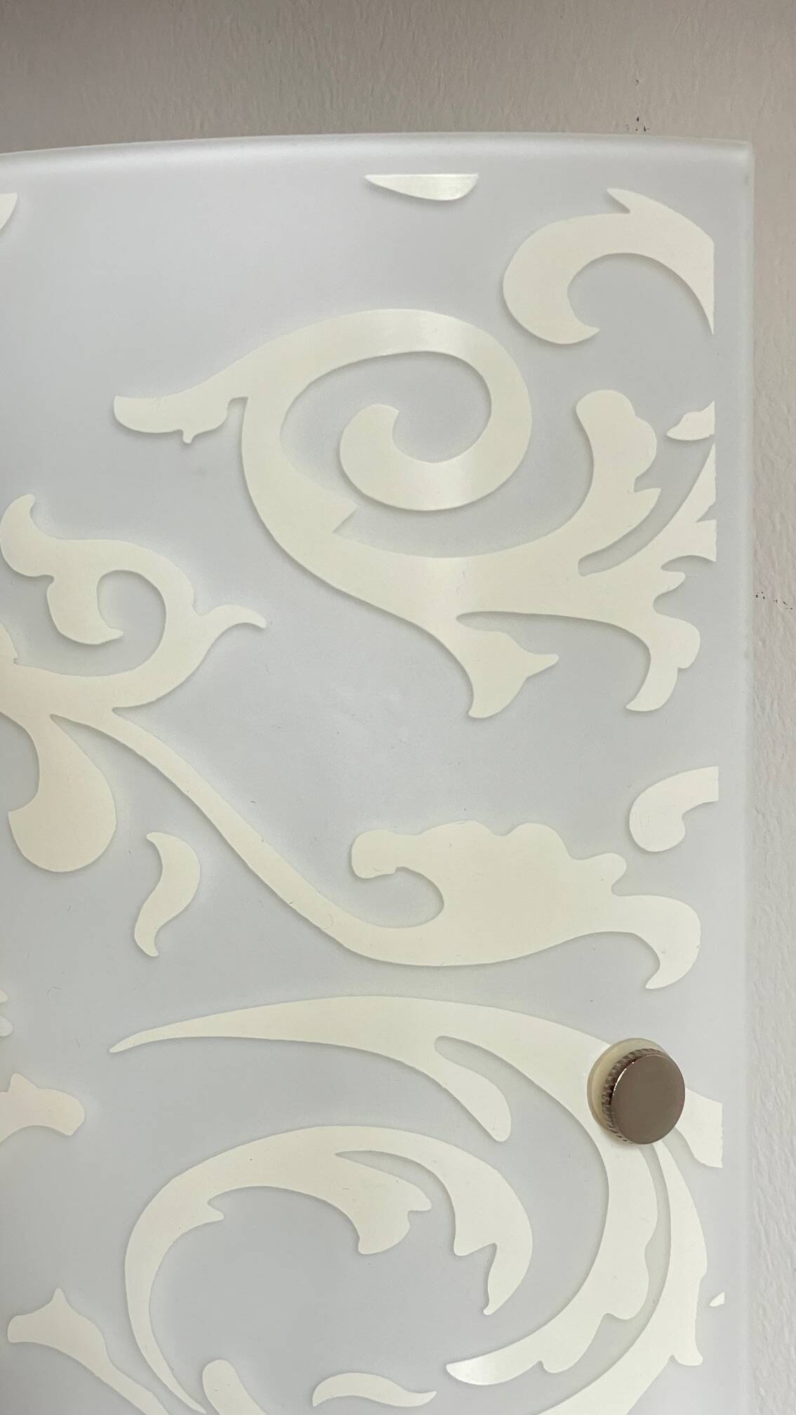 Polished and screen-printed glass sconce by eglo