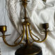 Pair of Empire style candlesticks, patinated brass and black stone.