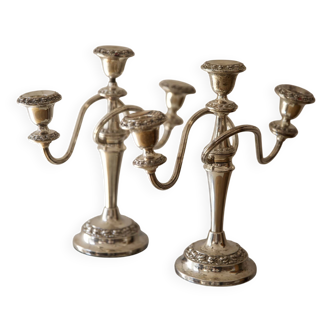 duo of silver metal candlesticks