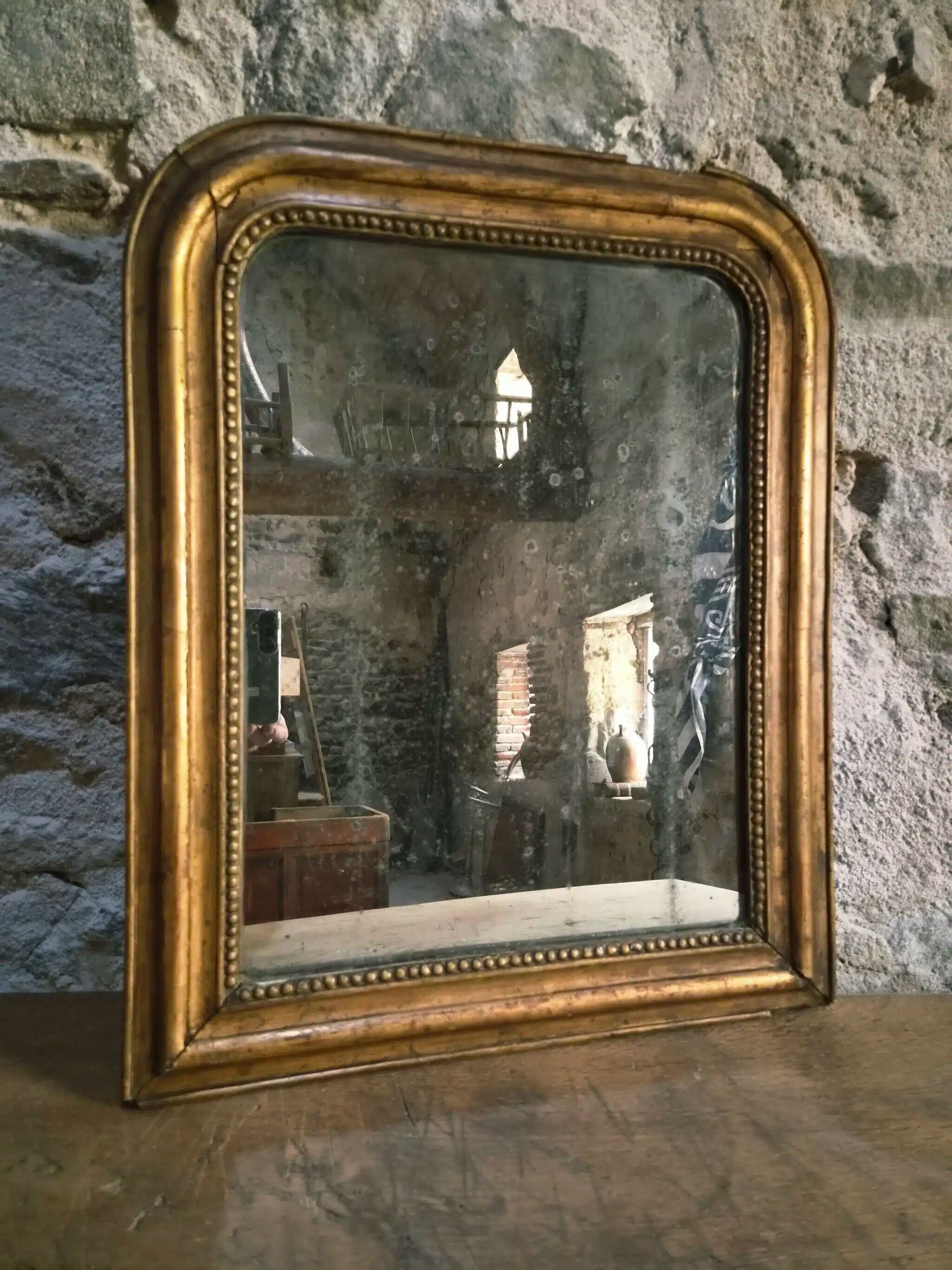 Antique French Louis Philippe mirror, gilded mercury mirror, 19th century.