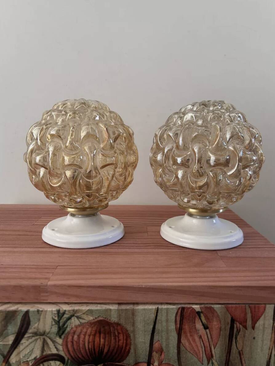 Pair of gold glass globe wall lights