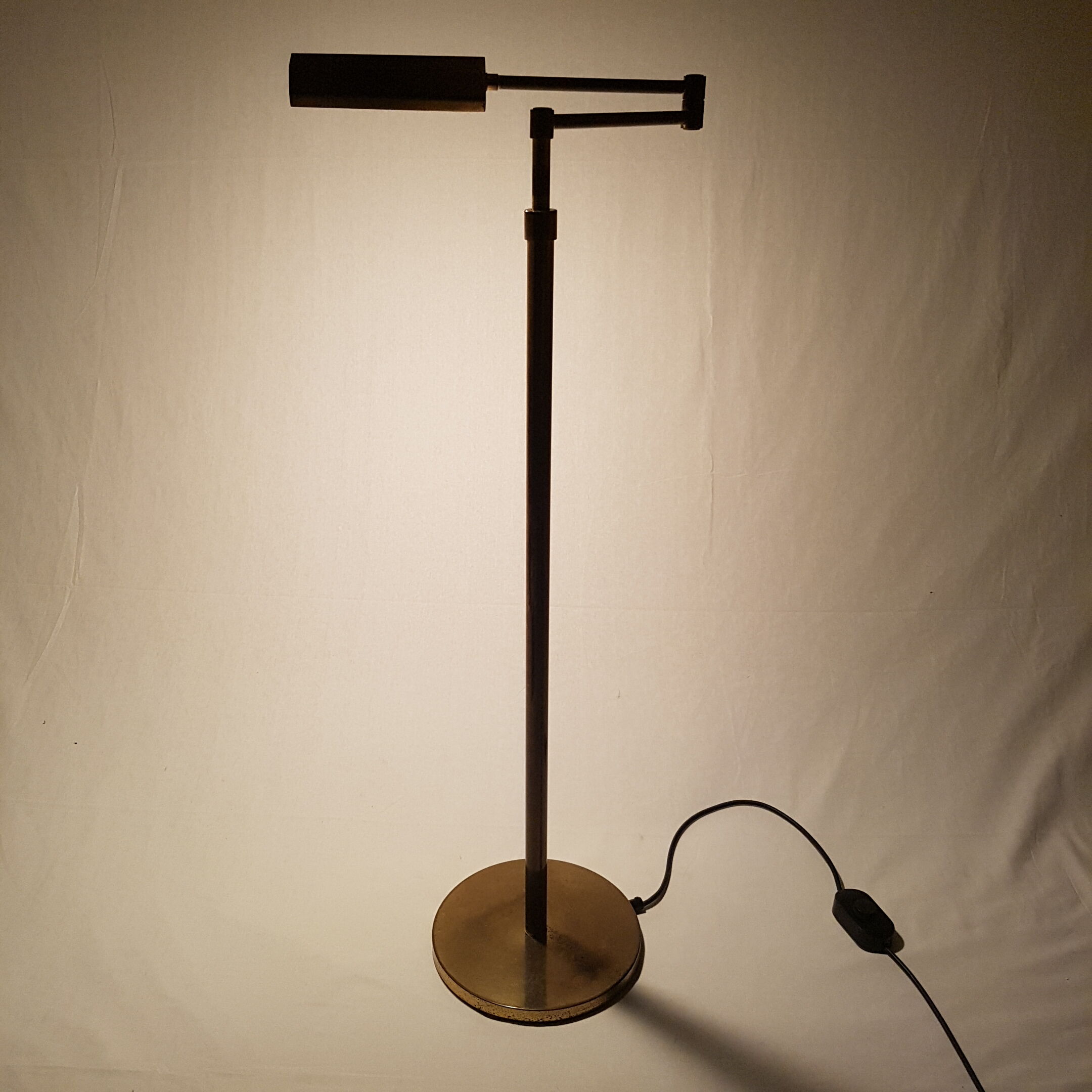 Articulated brass floor lamp