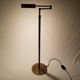 Articulated brass floor lamp