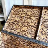 Trunk, black wooden chest and wallpaper