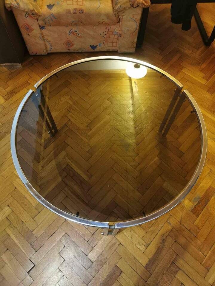Mid-century round coffee table in silver chrome with a glass top — 1960s