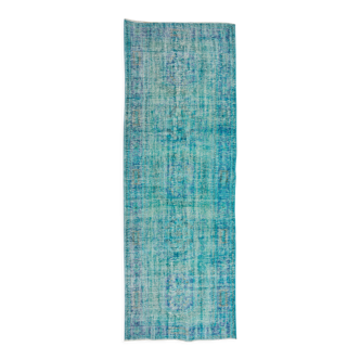 Vintage turkish rug over-dyed in teal blue color