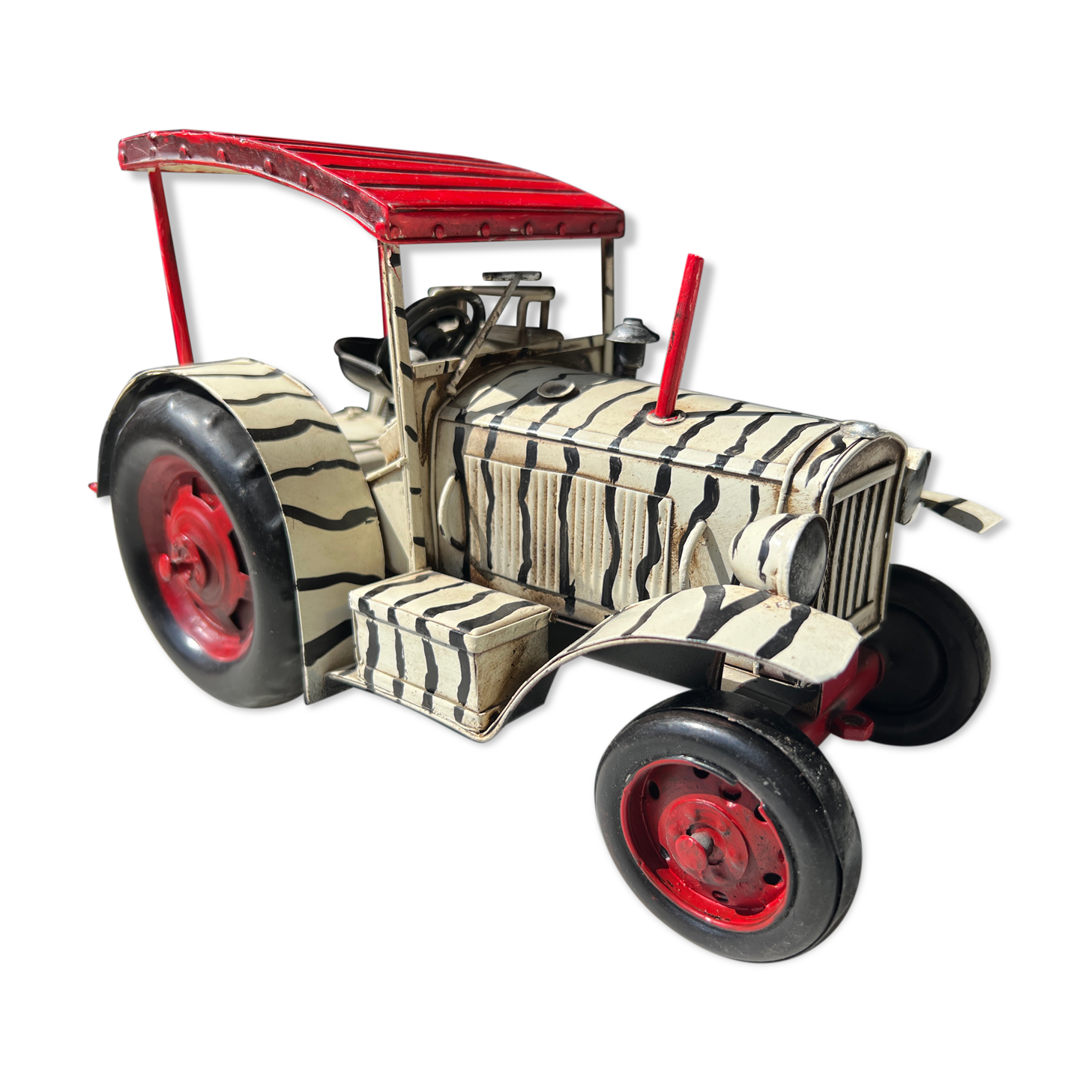 Old zebra metal tractor