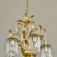 Golden metal chandelier in crystal pendants