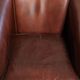 Set of 2 sheepskin club armchairs in a dark cognac colour