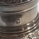 Crystal and solid silver shaker, neck brace and master's mark.