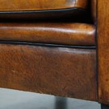 Sheep leather Art Deco design armchair finished with black piping