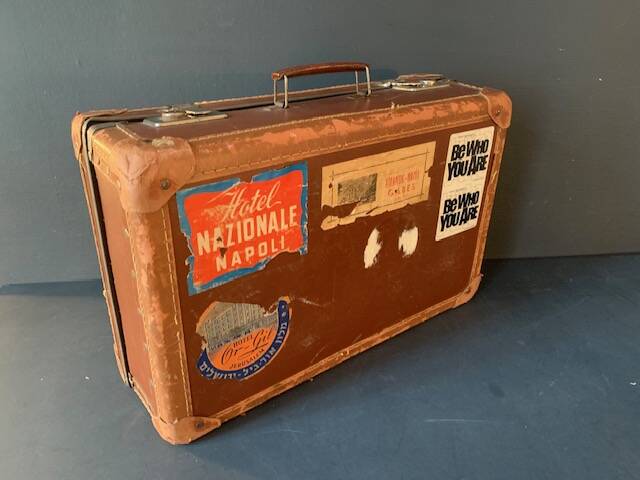 Old travel suitcase and legendary stickers, 1920