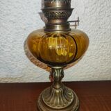 Antique kerosene lamp with yellow glass