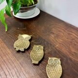 Brass owl emptiers