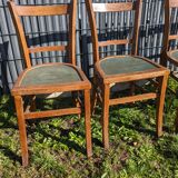 Set of four wooden bistro chairs, green seat, mid-20th century.