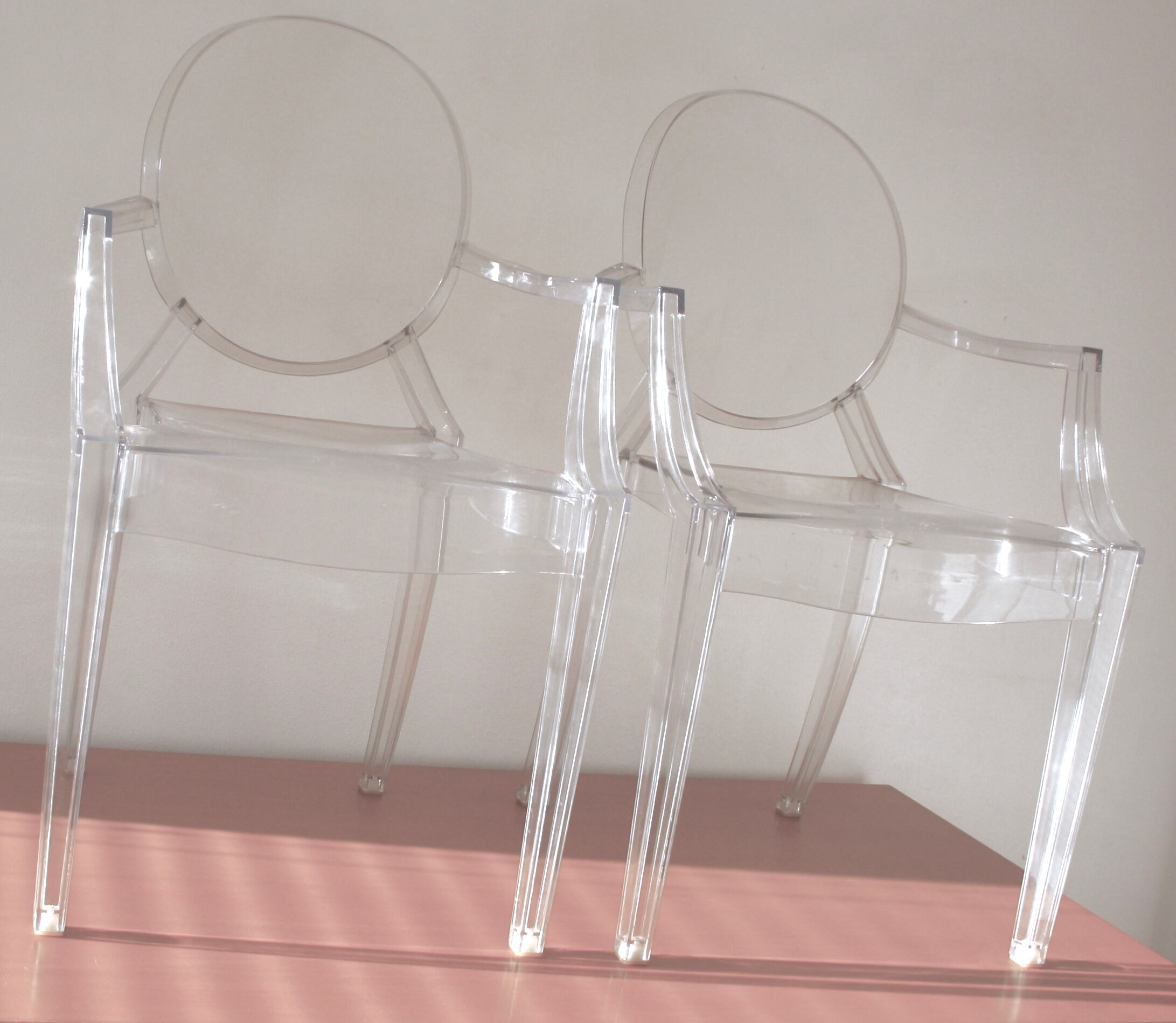 Two Starck chairs transparent model Louis Ghost