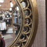 Round golden mirror